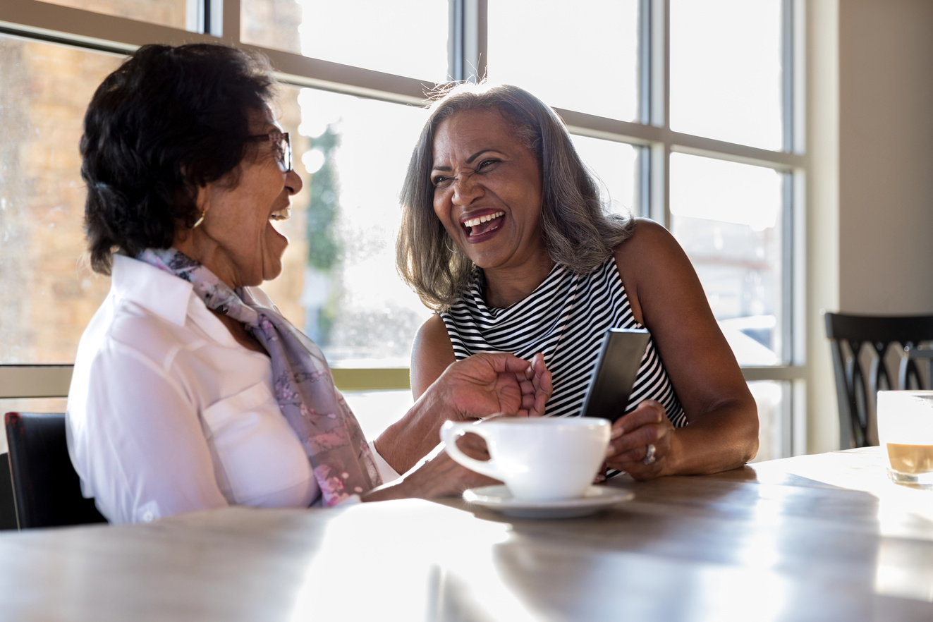 Senior women lauging in coffee shop
